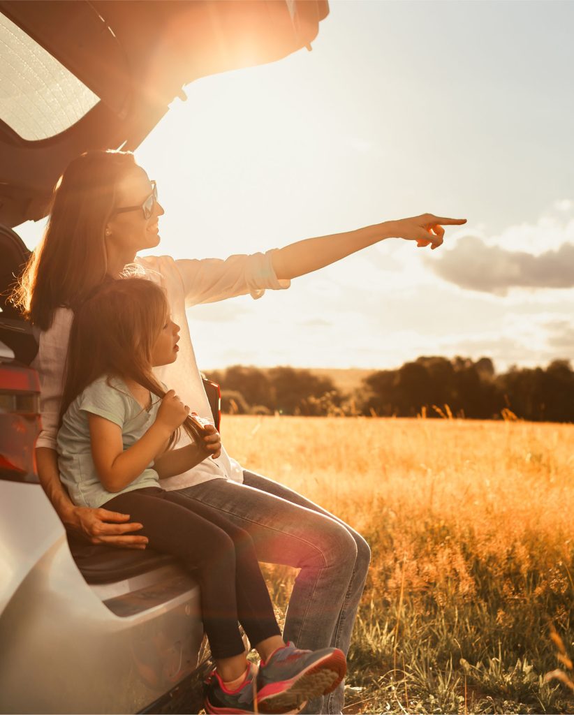 Prime Car Rental Naxos happy mother with her daughter sitting in a car